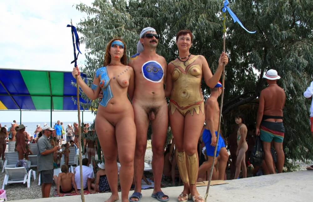 Three Painted Girl Poses pics - Living without unnecessary worries or restrictions is the essence of naturism