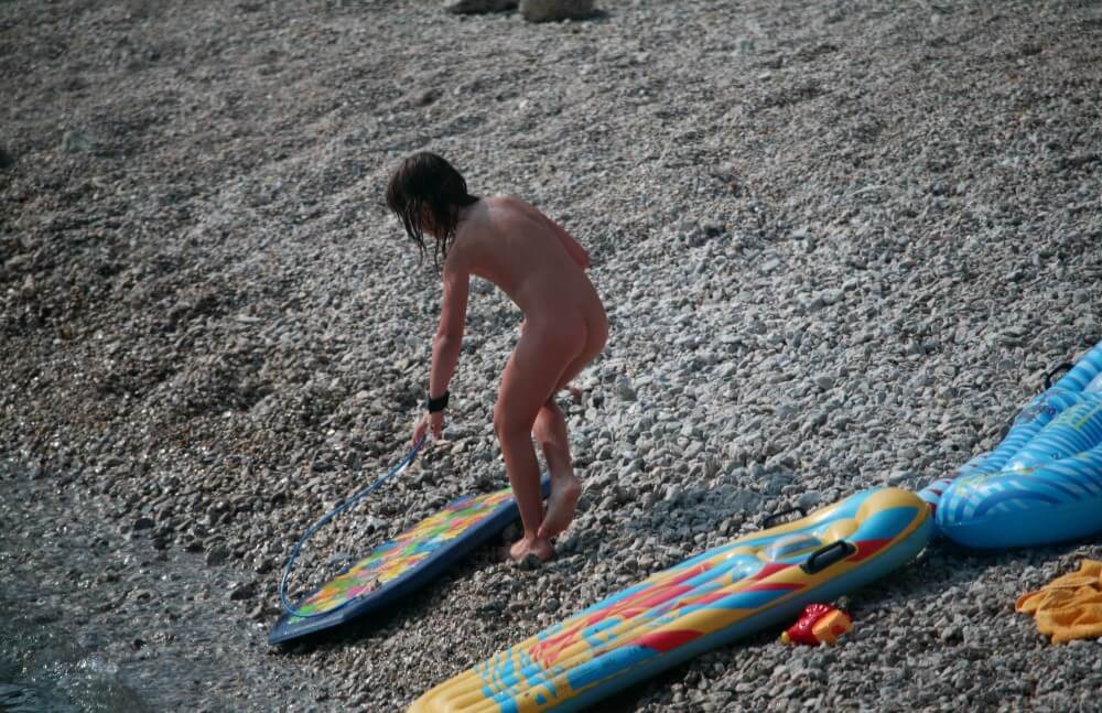 Naturist Surf Board Glides pics - Clothing is also a mask for a nudist