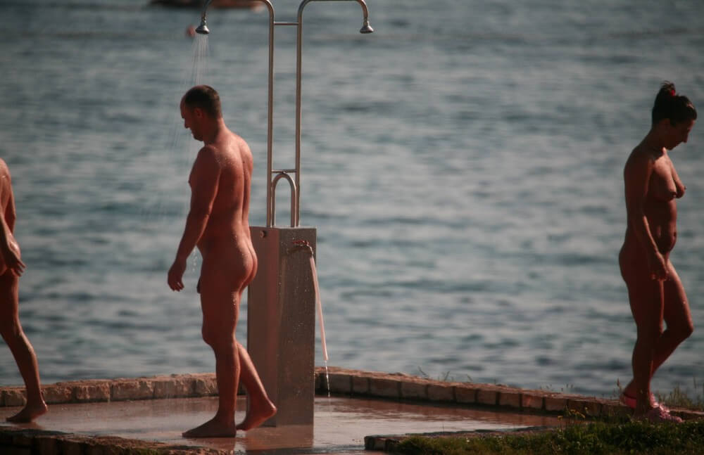 Naturist Shower at Dusk pics - Nudity in naturism is not usually an end in itself