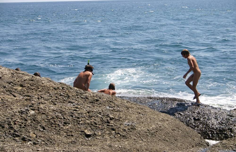 Leaning Against Hit Rocks pics - Naturism and nudism are a philosophy of respect